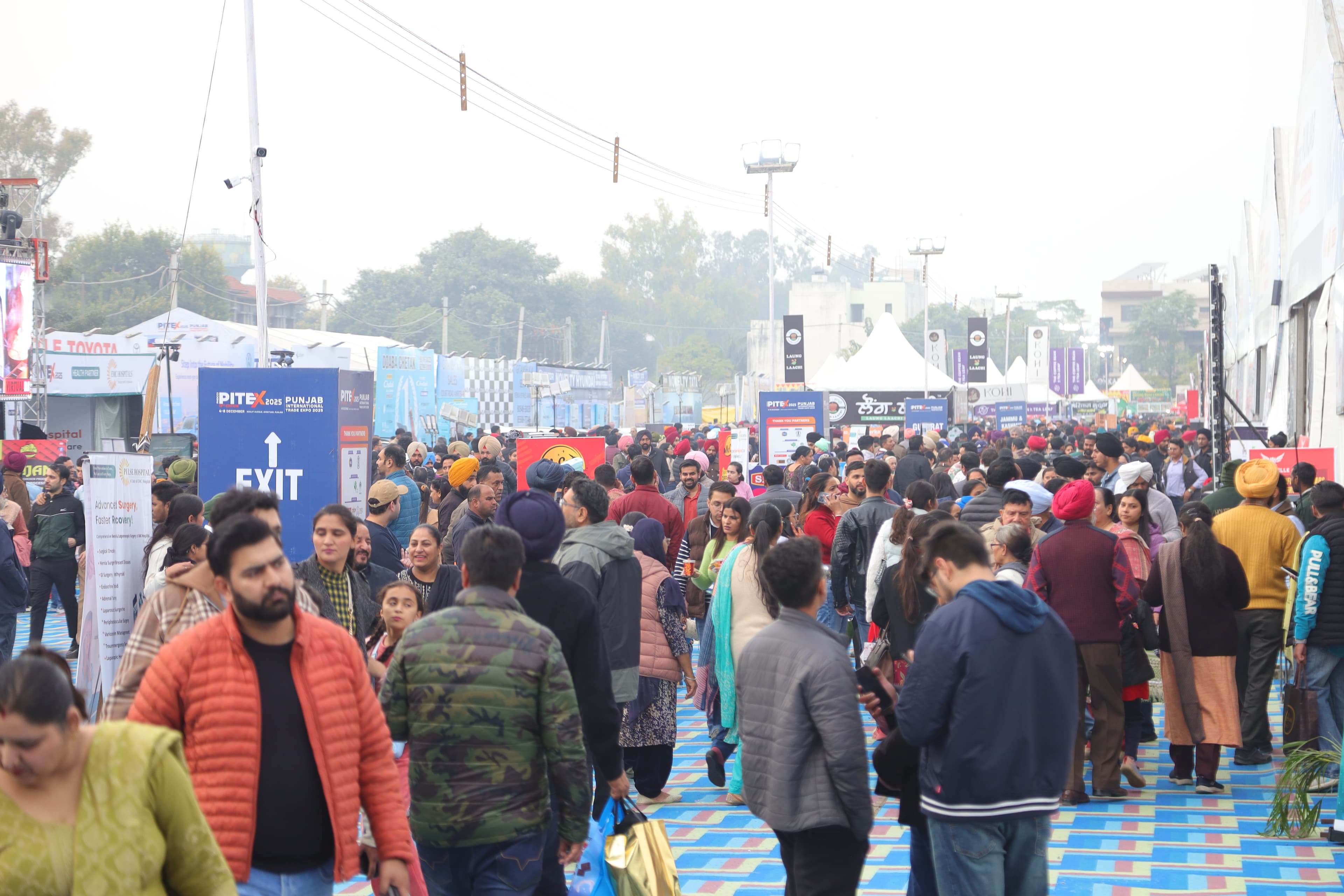 Visitors walking between exhibition halls