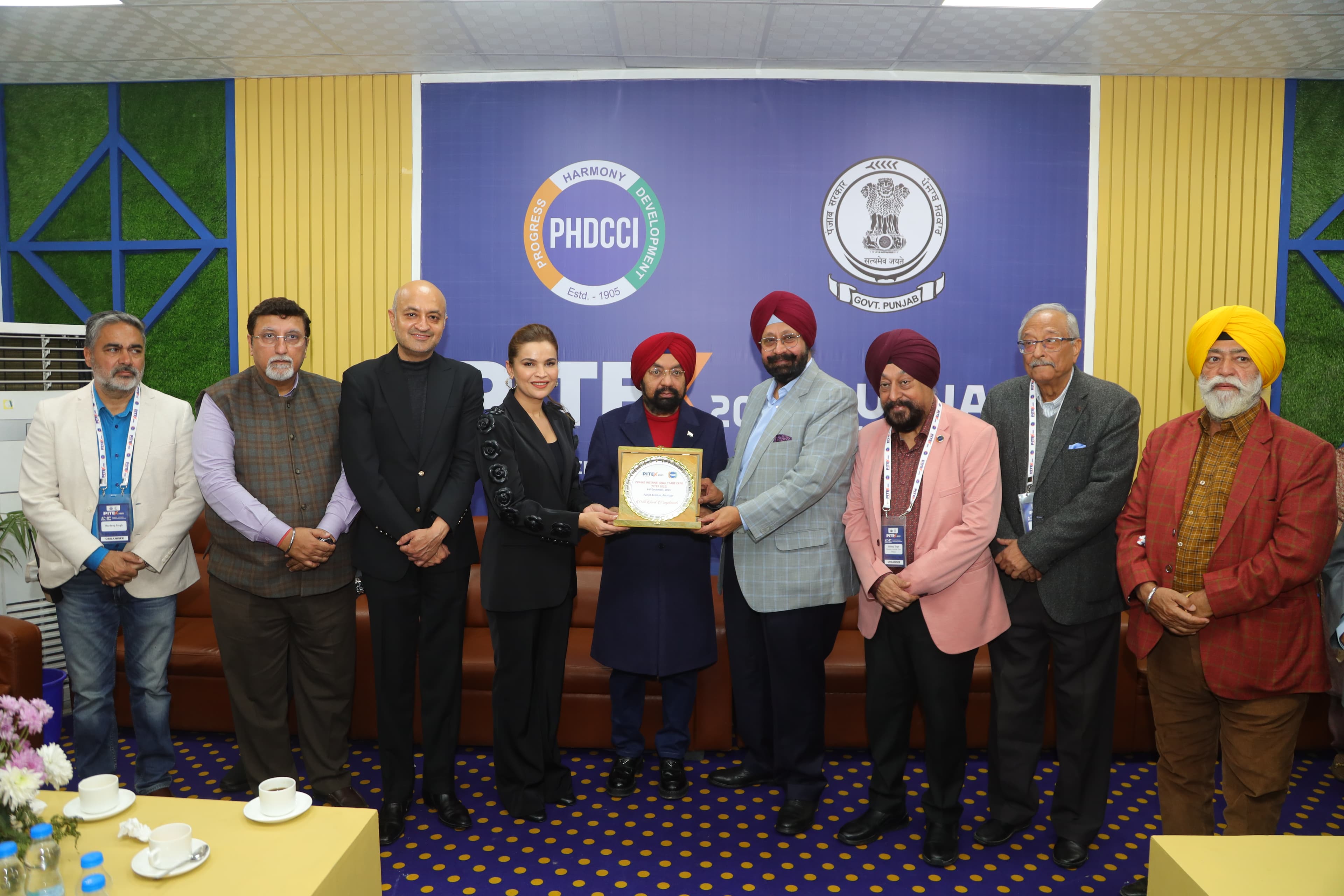 Guests presenting a commemorative plaque at an earlier gathering